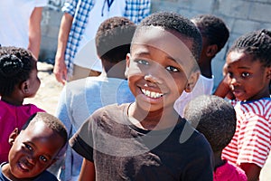 He enjoys these outreach events. Cropped portrait of a young child at a community outreach event.