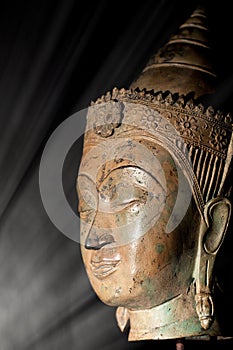 Enlightenment. Spiritual image of buddha head in a beam of light