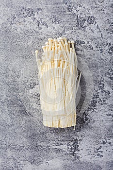 Enoki mushrooms - popular ingredient in asian cuisine. Edible needle mushroom or Enokitake