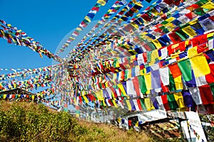 Enormous amount of buddhist praying flags decorating temple in nepal