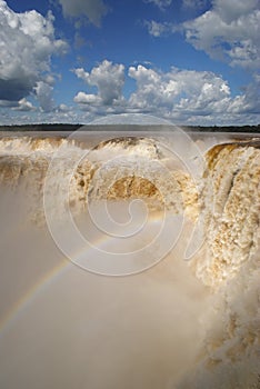 Enormous amounts of water thundering down the devil's throat at Iguazu waterfall, Argentina