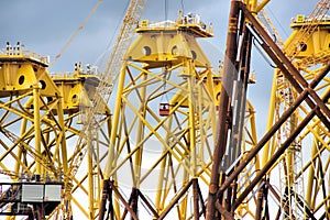 Workers in a hoist at an offshore wind turbine bases construction on Tyneside photo