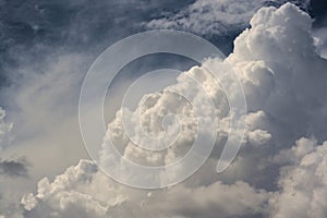 Enormous cloud in the dark blue sky photo