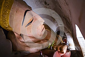 Enormous reclining buddha statue in Manuha Paya, Myinkaba Village, Bagan, Myanmar