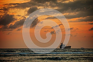 Enormous Tanker Ship on the Horizon at Sunset