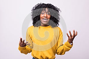 Enraged young woman with hands up yelling isolated on white background