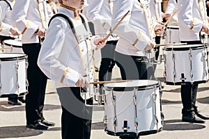 The ensemble of drummers in white ceremonial dress