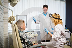 Ent doctor or Otolaryngologist examining a boy