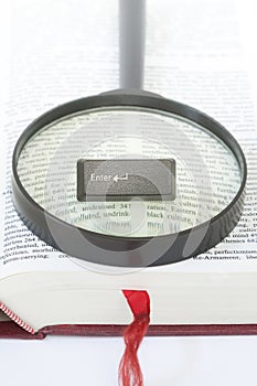 Enter Computer Key on a magnifying glass