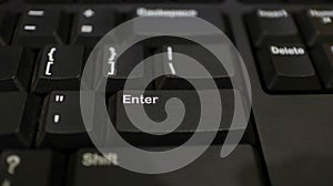 The ENTER key on the black keyboard