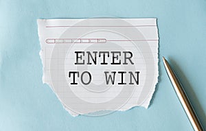 Enter to Win text on paper. Word Enter to win on blue background. Concept Image