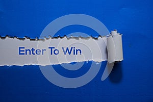 Enter To Win Text written in torn paper