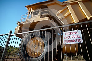 Entering enclosured prohibited sign placing on the face when haul track heavy duty equipment parke