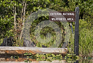 Entering National Wilderness Area kayak Canoe trail direction sign Okefenokee Swamp National Wildlife Refuge, Georgia USA