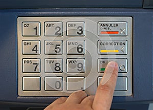 Entering nip code numbers in cash machine by pressing buttons