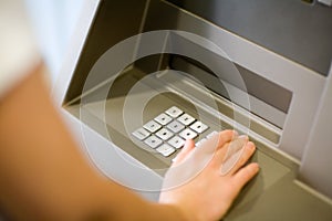 Entering PIN at ATM