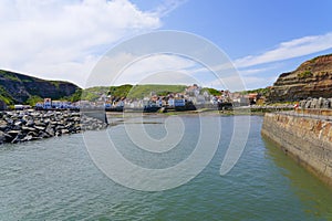 Entering Staithes harbour in North Yorkshire at low tide