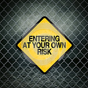 Entering at Your Own Risk Grunge Yellow Warning Sign