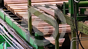 Enterprise for the production of cardboard containers . Closeup image of pleat cardboard row at factory background. Manufacture of