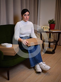 enterprising woman sitting showing off her new product