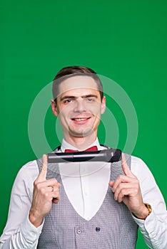 The entertainer. Young elegant talking man holding microphone, Isolated in studio