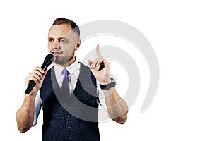 The entertainer. Young elegant talking man holding microphone, Isolated on white background