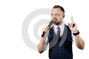 The entertainer. Young elegant talking man holding microphone, Isolated on white background