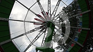 Entertainment attraction Surprise in the park of recreation and entertainment. Children and adults ride the carousel. An