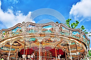 Entertainment Carousel for the youngest children. Horses on a ca