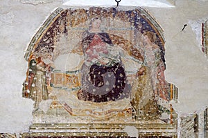 Enthroned Madonna and Child with five angels, Saint Catherine and a worshipper photo