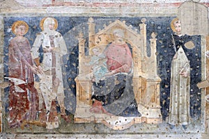 Enthroned Madonna and Child, Saints Catherine, George, Peter the Martyr and a worshipper Knight