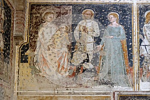 Enthroned Madonna and Child, Saints George, Catherine and a worshipper Knight