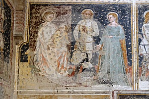 Enthroned Madonna and Child, Saints George, Catherine and a worshipper Knight photo