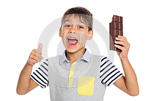 Enthusiastic boy with a chocolate bar