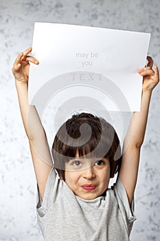 Enthusiastic boy with placard