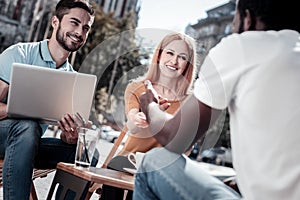 Enthusiastic business people working outdoors