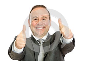 Enthusiastic businessman giving thumbs up signal