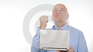 Enthusiastic Businessman Use a Laptop for Communication and Gesticulate Happy
