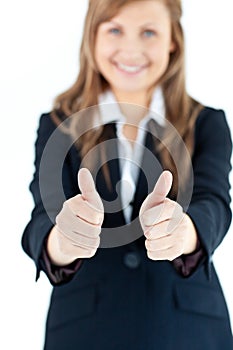 Enthusiastic businesswoman with thumbs up