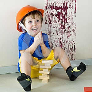 Enthusiastic child in role of the builder