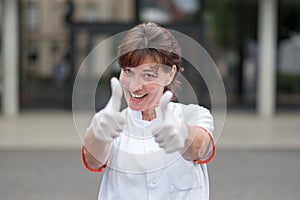 Enthusiastic doctor giving a thumbs up gesture