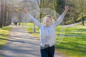 Enthusiastic fit woman cheering and celebrating