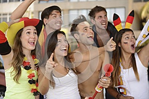 Enthusiastic German sport soccer fans celebrating victory. photo