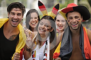 Enthusiastic German sport soccer fans celebrating victory.