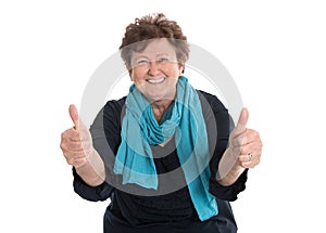 Enthusiastic and happy grandmother making thumbs up gesture with