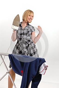 Enthusiastic housewife ironing