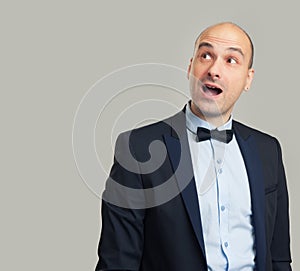 Enthusiastic man looking up photo