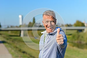 Enthusiastic motivated man giving a thumbs up