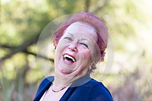 Enthusiastic Senior Woman Giving a Genuine Laugh