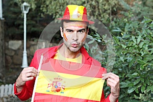 Enthusiastic Spanish man waving the national flag